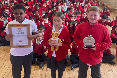 St Woolos Primary School children with their 'My Best School Trip' Award certificate and trophy